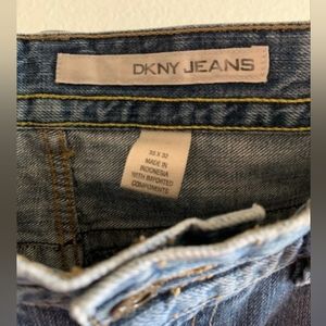 DKNY: medium dark denim and small tear at the left knee on the front side